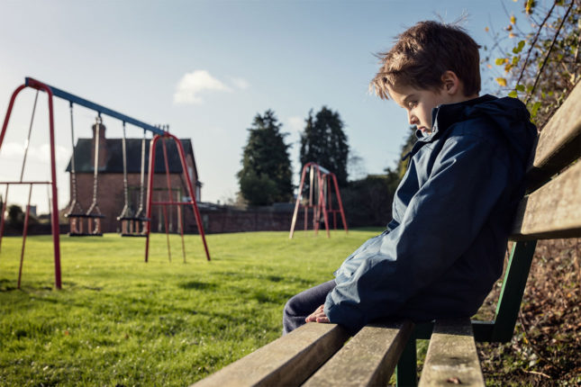 Child-alone-on-bench